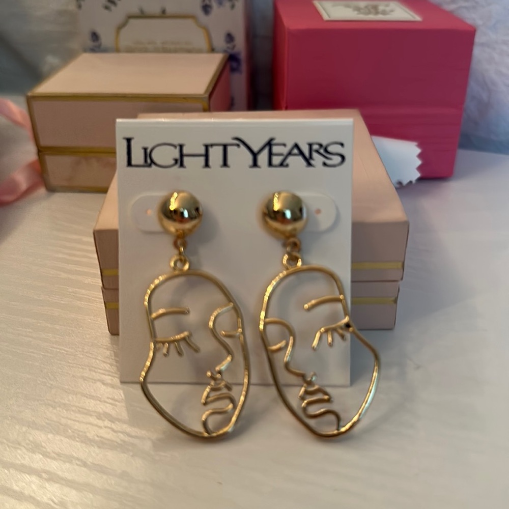 Brand new face earrings